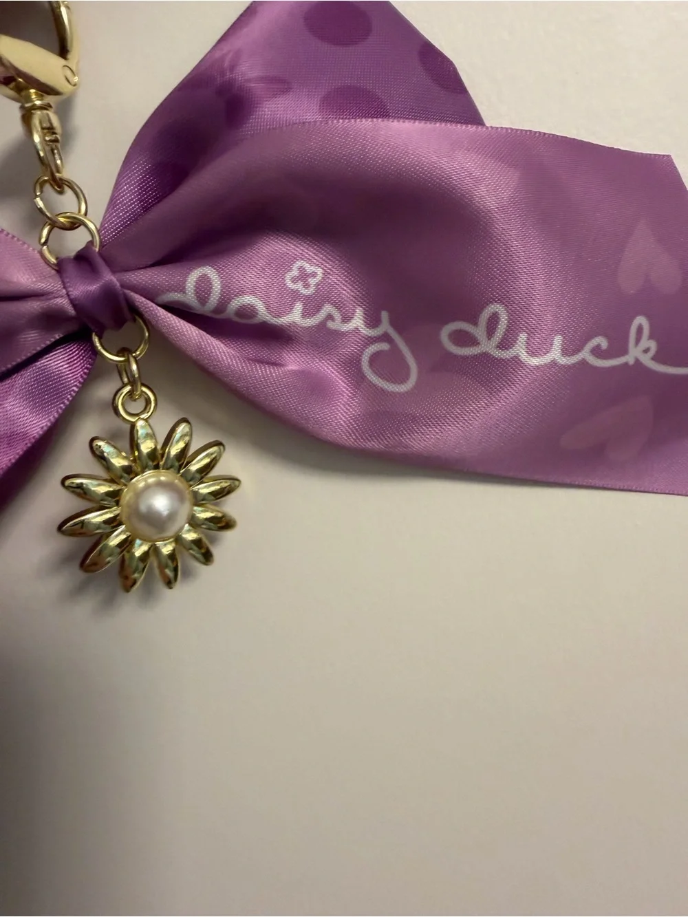 Disney Lavender Satin Bow Gold Daisy Pearl Charm keychain